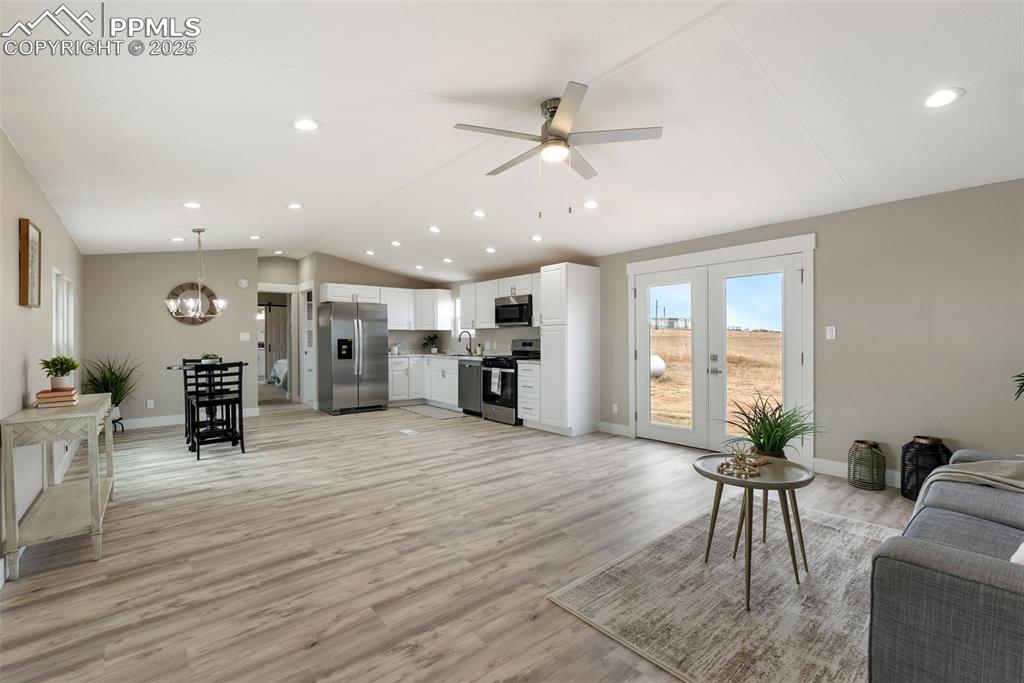 6190 Night Train Lane Yoder, CO 80864 - Photo 7 of 35 a living room with furniture and wooden floor