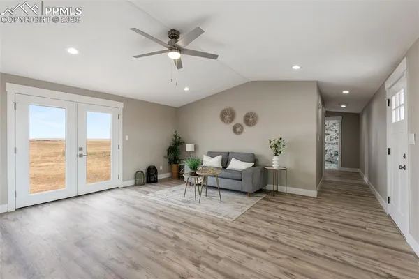 a living room with furniture and a window