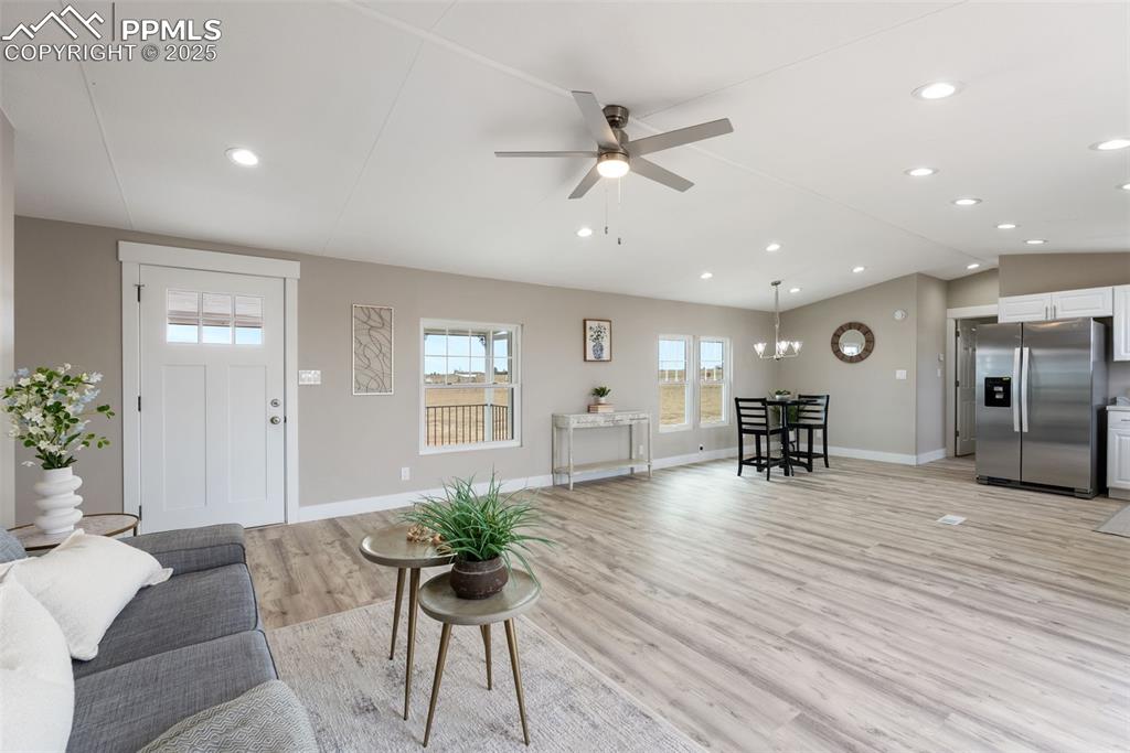 6190 Night Train Lane Yoder, CO 80864 - Photo 10 of 35 a living room with furniture and wooden floor