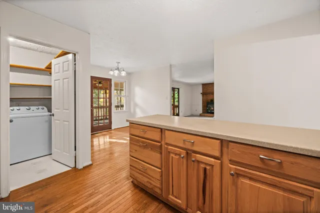 a spacious bathroom with double vanity and mirrors