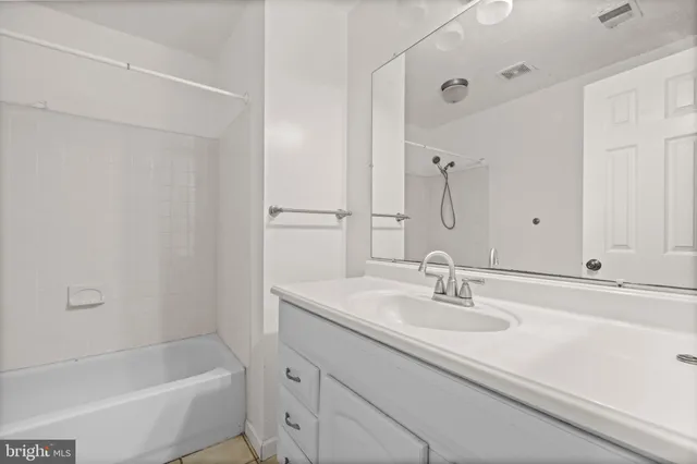 a bathroom with a sink and a bathtub