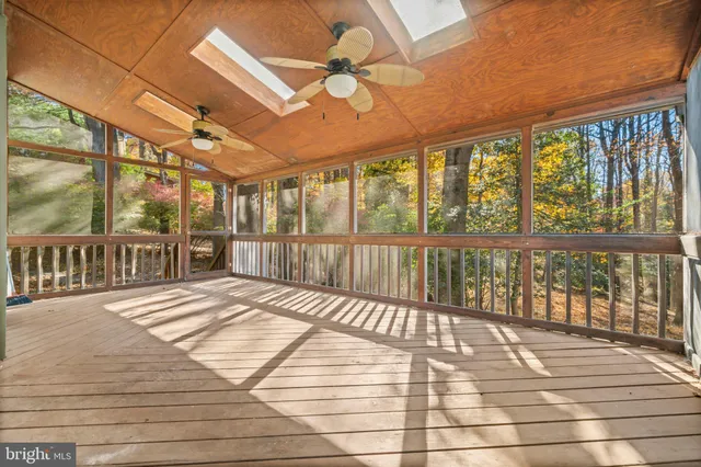 a view of a balcony with wooden floor