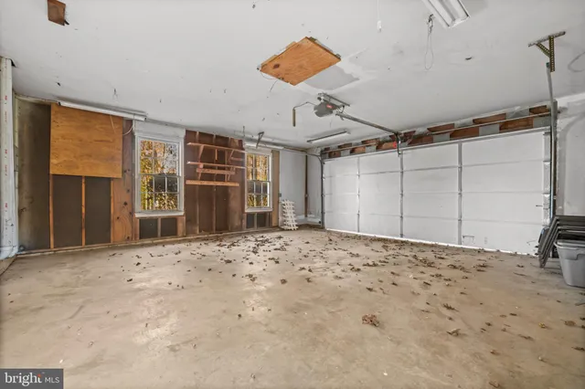 a view of a house with yard and sitting area