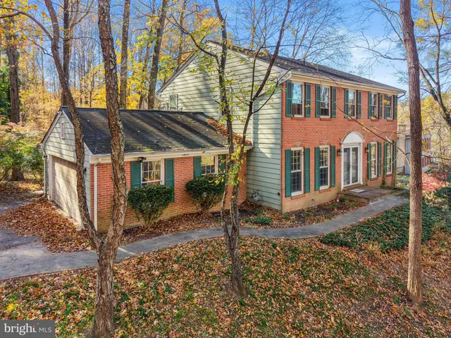 front view of a house with a tree