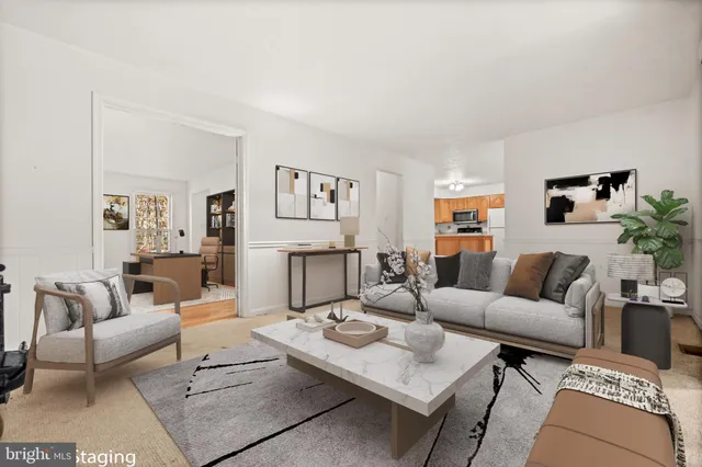 a living room with furniture and a table