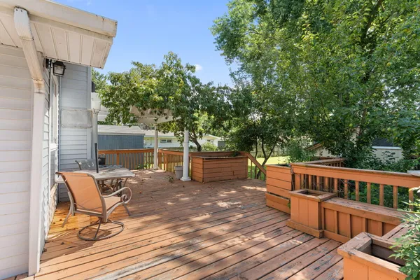 a view of a chairs and table on the wooden floor