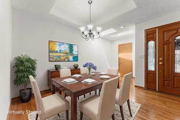 a view of a dining room with furniture and wooden floor