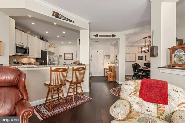 a kitchen with stainless steel appliances a refrigerator and a stove