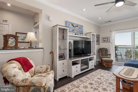 a bed room with a bed window and a dresser