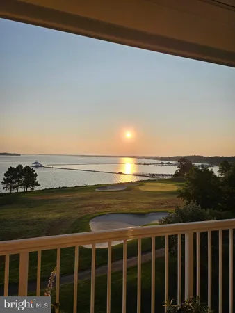 a view of swimming pool with a table and chairs