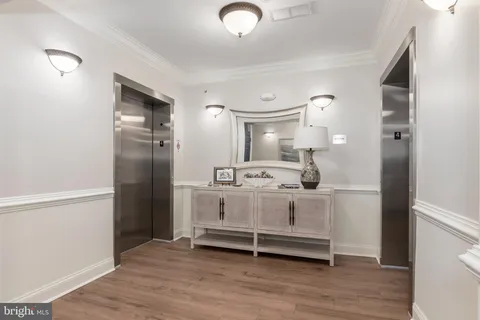 a view of a dining room with furniture wooden floor and a rug