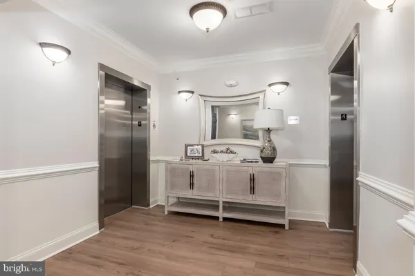 a view of a dining room with furniture wooden floor and a rug