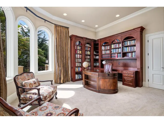 a kitchen with stainless steel appliances granite countertop a stove a sink and white cabinets