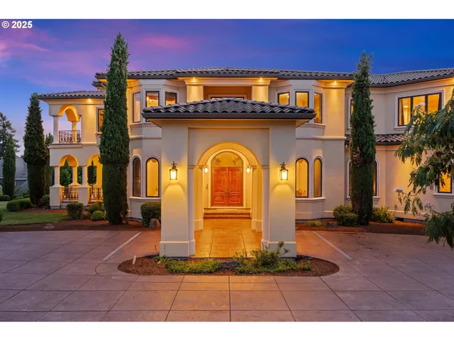 a front view of a house with a yard table and chairs