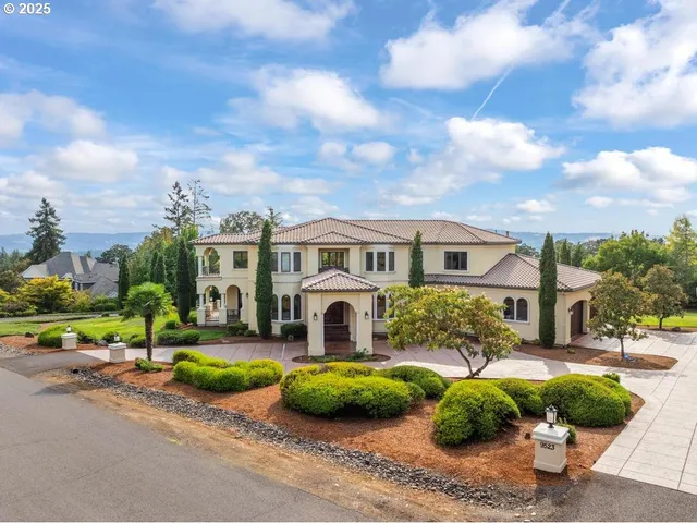 a living room with furniture a clock and a large window