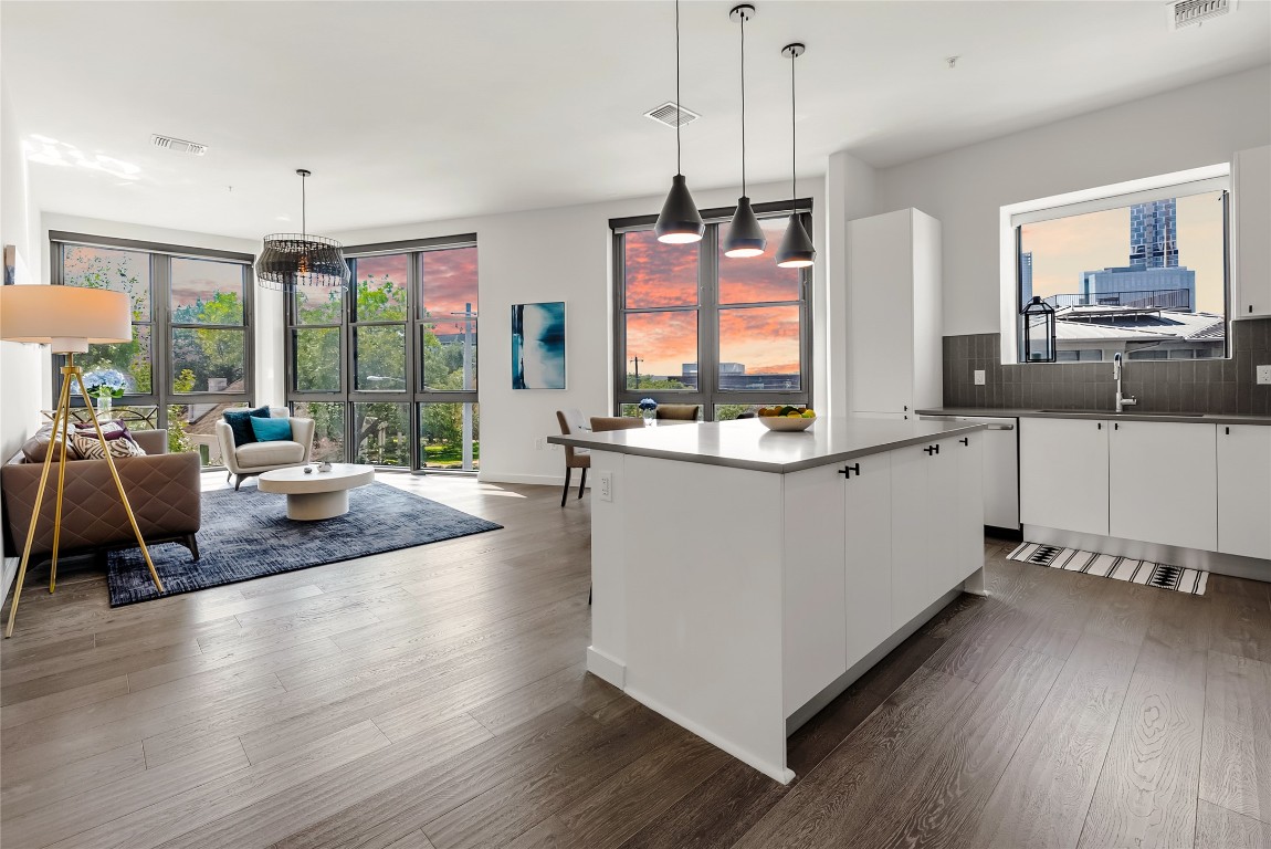 800 Embassy Drive, Unit 337 Austin, TX 78702 - Photo 28 of 29 a living room with stainless steel appliances granite countertop furniture a large window with wooden floor