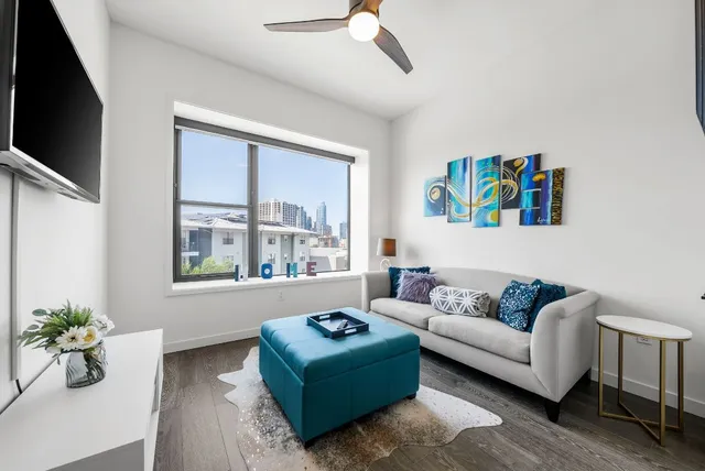 a large bathroom with a double vanity sink a toilet and shower