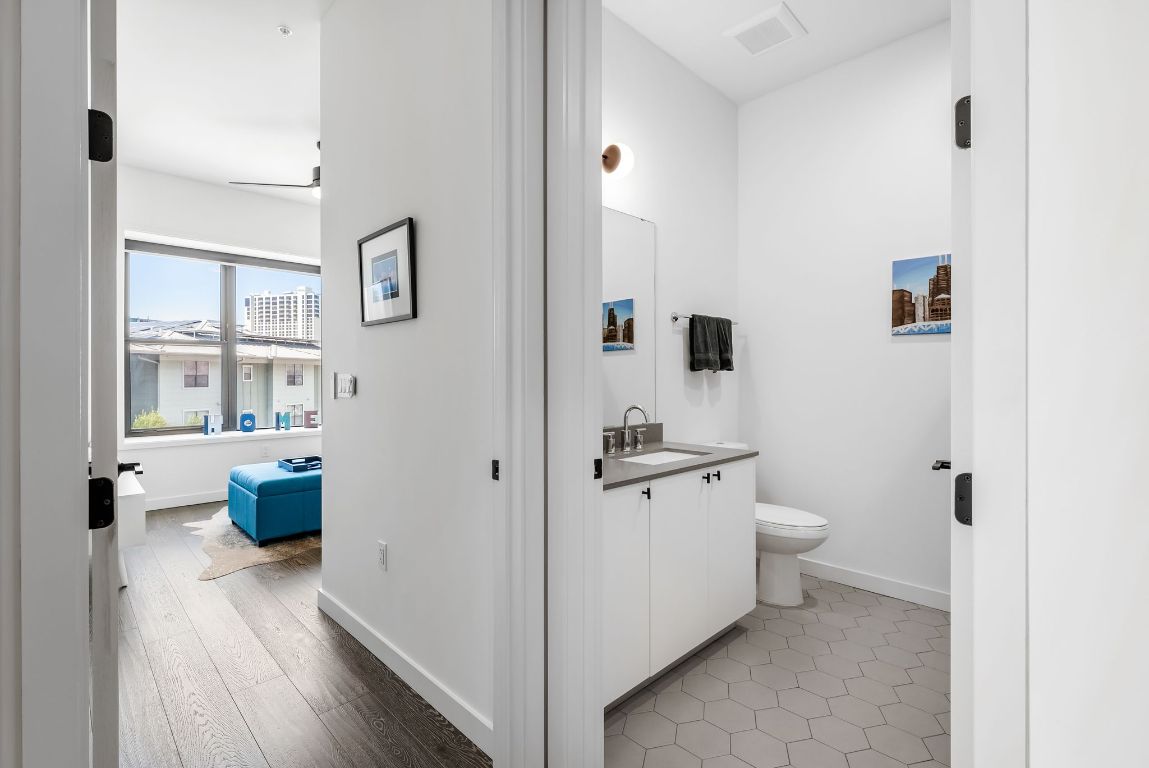 800 Embassy Drive, Unit 337 Austin, TX 78702 - Photo 13 of 29 a bathroom with a toilet sink and shower