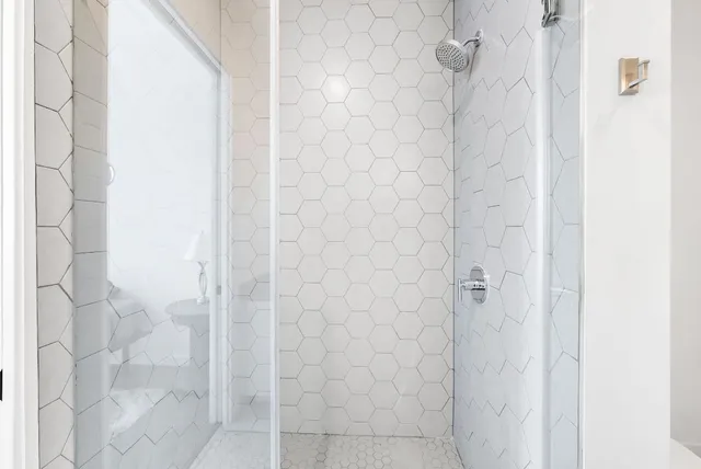 a bathroom with a sink mirror vanity and toilet
