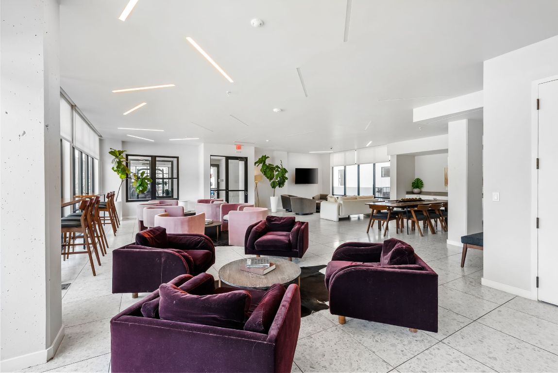 800 Embassy Drive, Unit 337 Austin, TX 78702 - Photo 19 of 29 a living room with furniture a red lamp and a window
