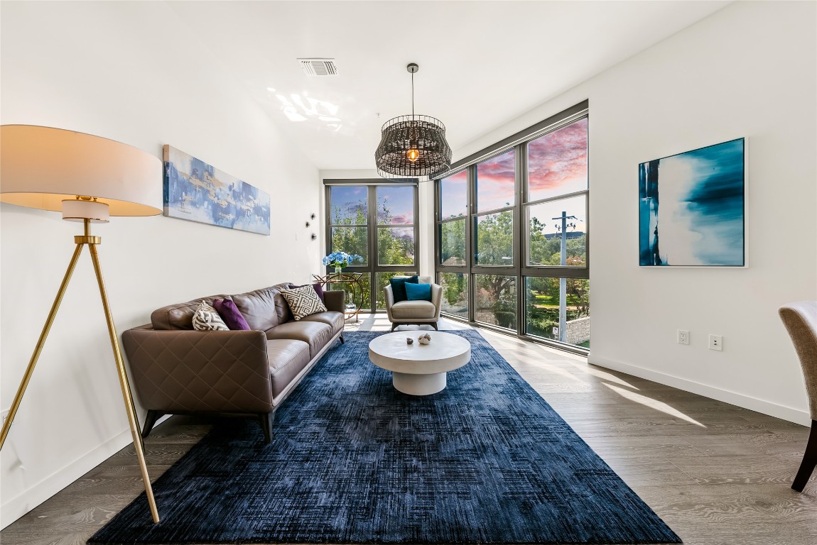 800 Embassy Drive, Unit 337 Austin, TX 78702 - Photo 1 of 29 a living room with furniture and a large window