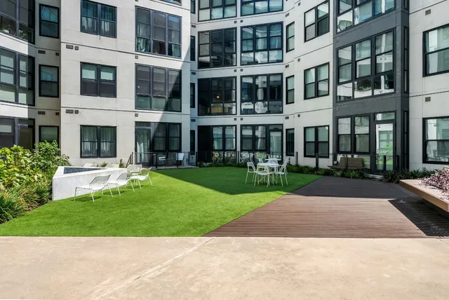 a view of a building with a yard