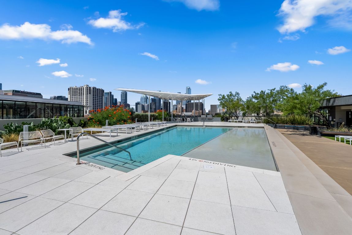 800 Embassy Drive, Unit 337 Austin, TX 78702 - Photo 23 of 29 a view of swimming pool outdoor seating and city view