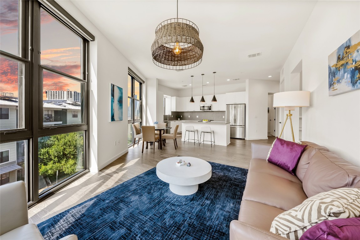 800 Embassy Drive, Unit 337 Austin, TX 78702 - Photo 2 of 29 a living room with furniture and a large window