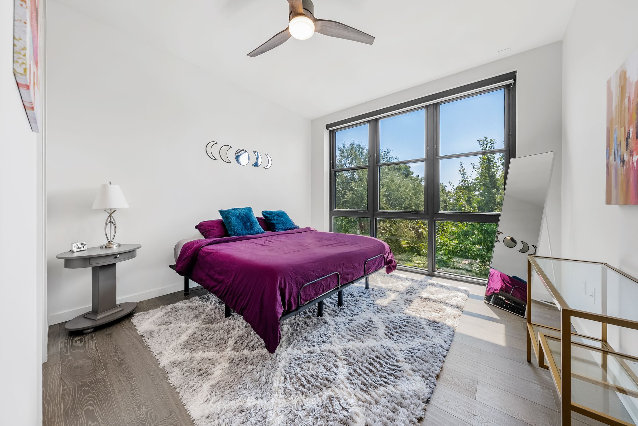 800 Embassy Drive, Unit 337 Austin, TX 78702 - Photo 9 of 29 a bed sitting in a bedroom next to a window