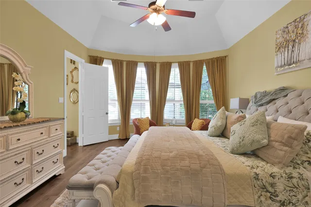 a bedroom with a bed and a dresser