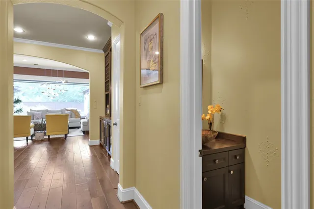 a view of a hallway view with wooden floor and furniture