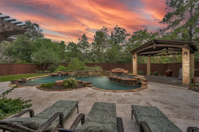 a view of a house with swimming pool and a yard