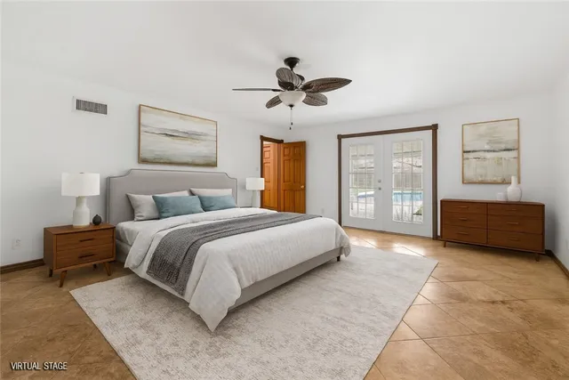 a living room with a bed furniture and a window