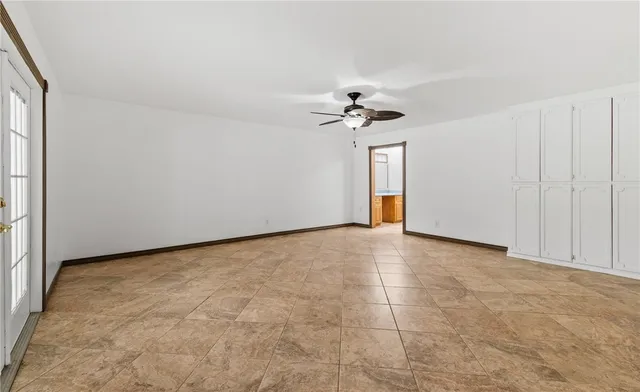 a view of an empty room with a bathroom