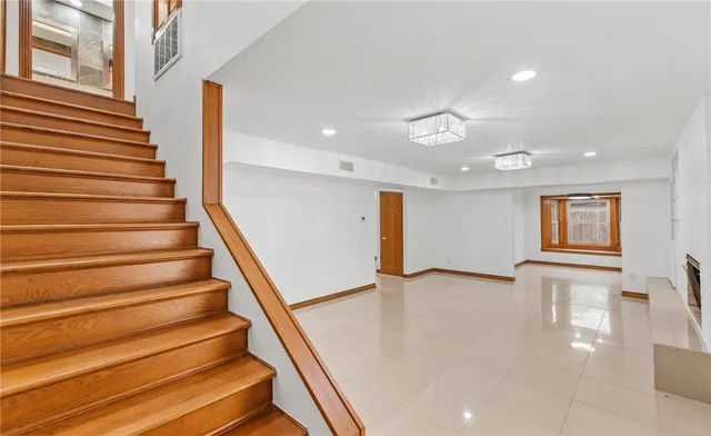 a view of an entryway with wooden floor