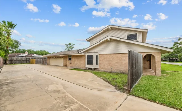 a front view of a house with yard