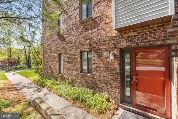 a brick building with a yard