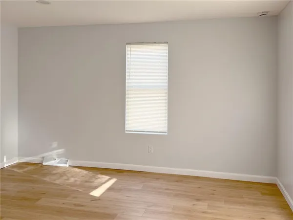 a kitchen with granite countertop a stove top oven sink and cabinets