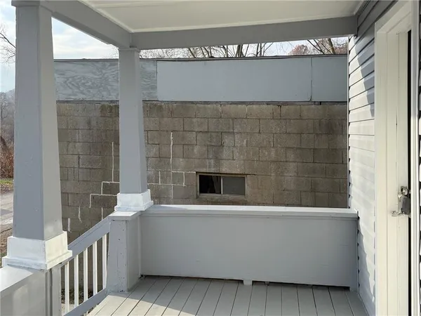 a living room with a couch and a fireplace