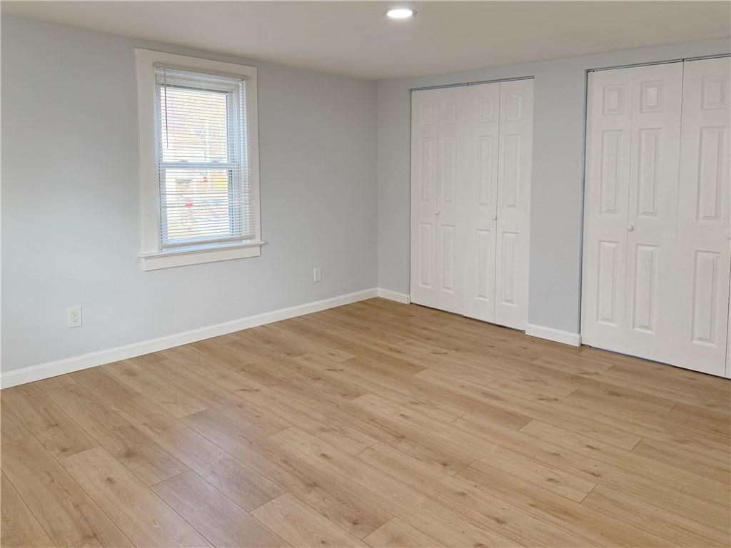 1252 Jefferson Street Vandergrift, PA 15690 - Photo 21 of 22 a view of empty room with wooden floor and fan