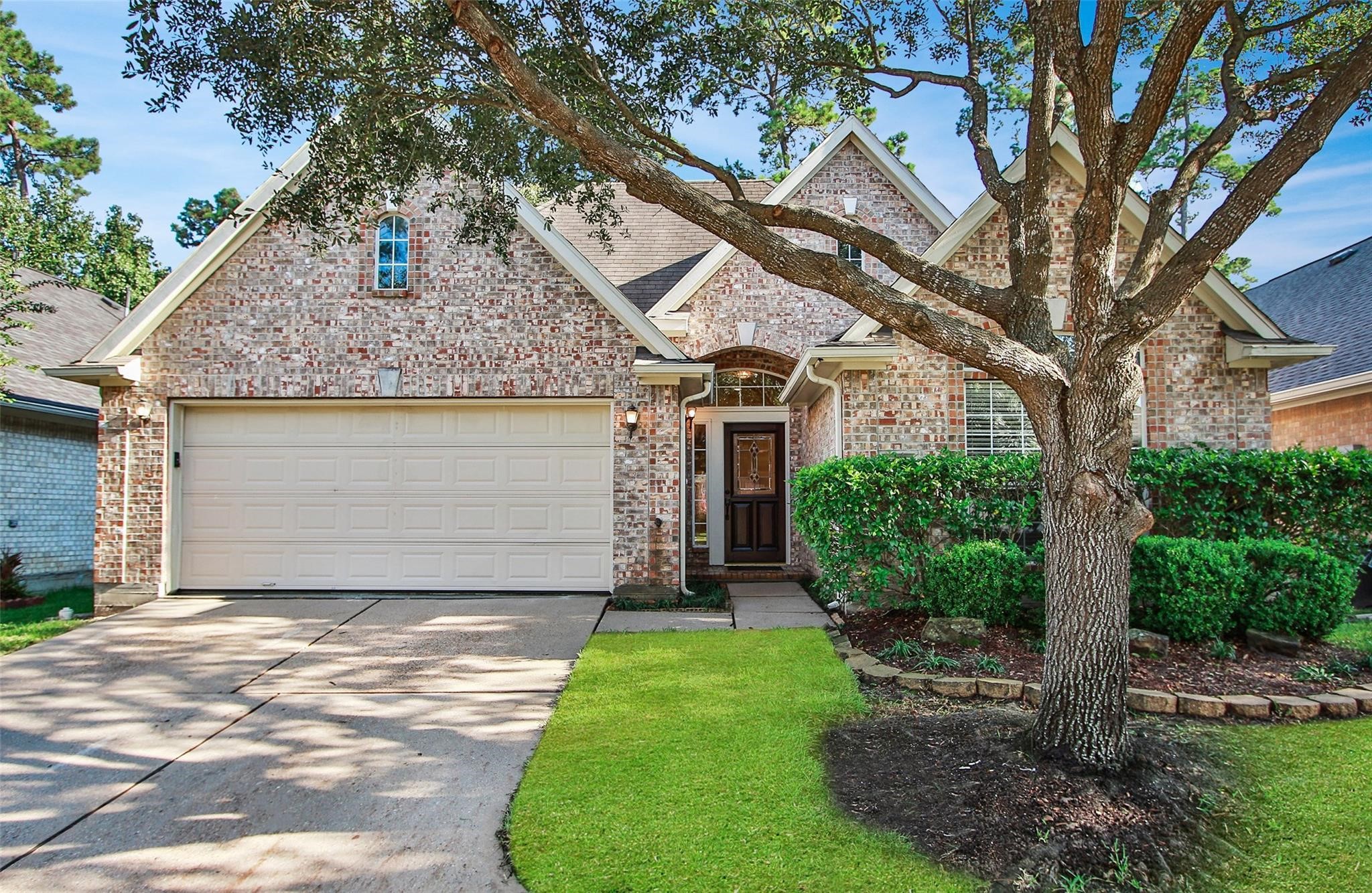 3415 Candlepine Drive Spring, TX 77388 - Photo 1 of 23 a front view of a house with a yard