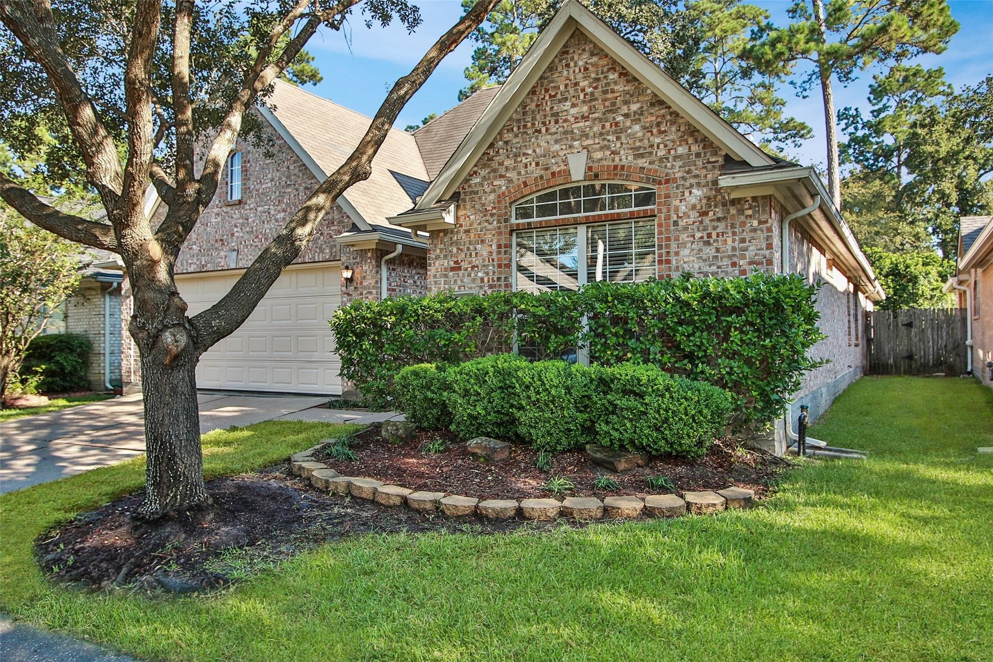 3415 Candlepine Drive Spring, TX 77388 - Photo 2 of 23 a view of a house with a yard and a large tree