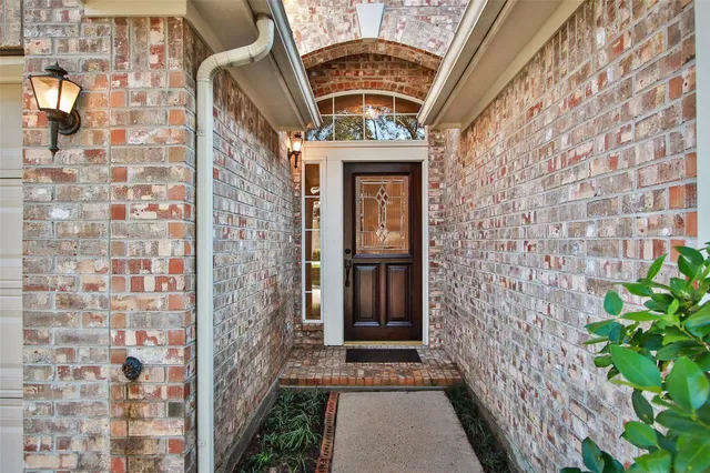 a entryway with brick walls