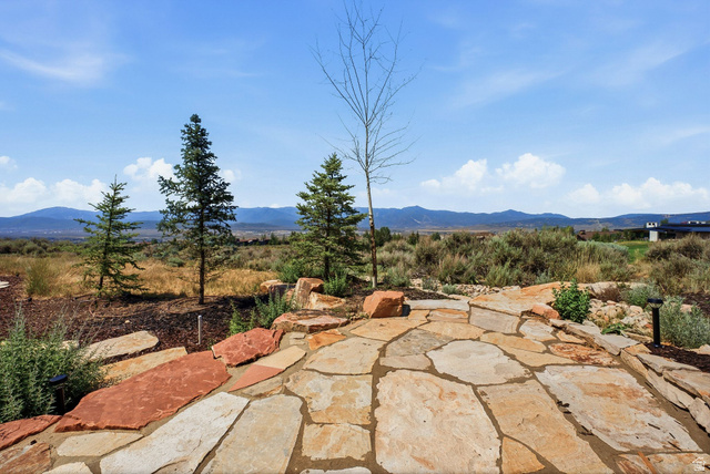 7885 North Rabbitbrush Court, Unit 13 Park City, UT 84098 - Photo 75 of 88 Expansive natural stone patio with varied flagstone pavers and integrated landscape lighting