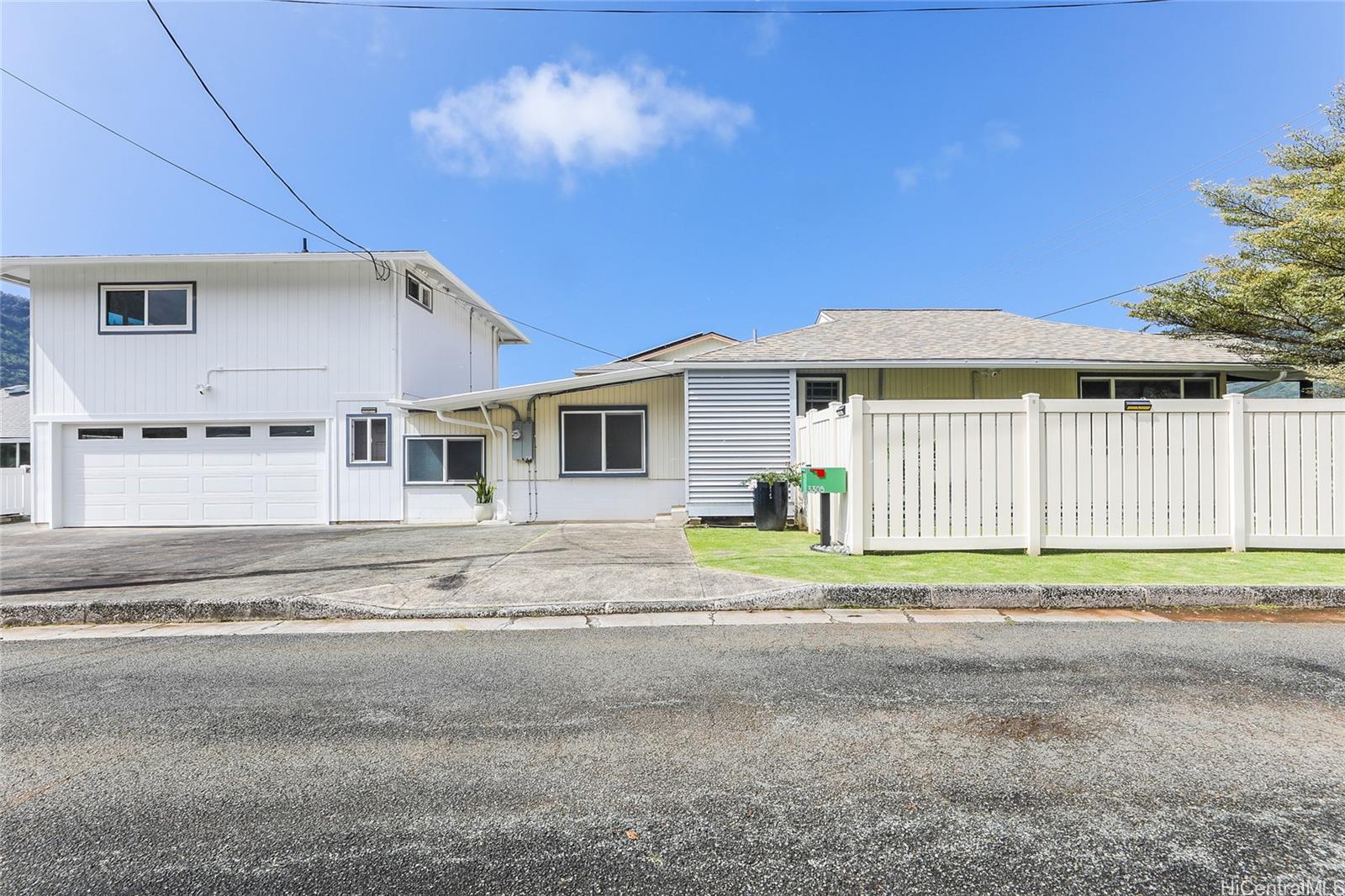 3305 East Manoa Road Honolulu, HI 96822 - Photo 1 of 25 a view of a house with a backyard and a garage