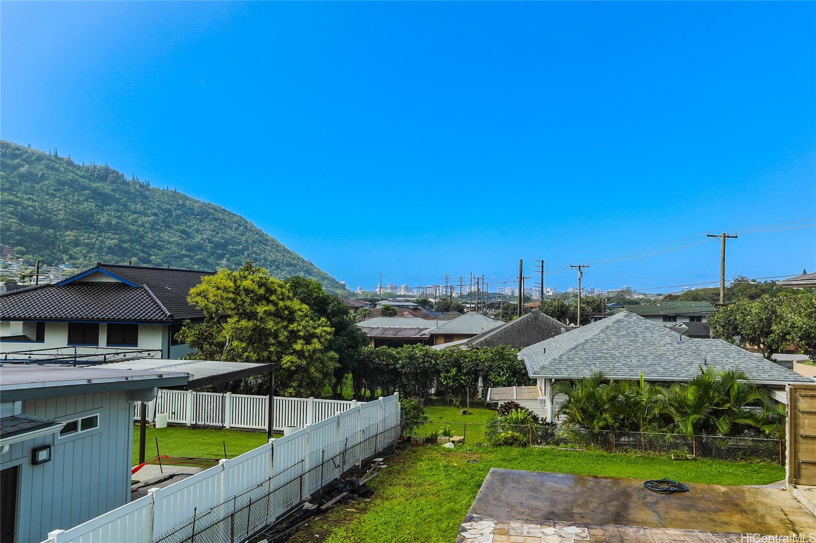 3305 East Manoa Road Honolulu, HI 96822 - Photo 18 of 25 a view of house with outdoor space and swimming pool