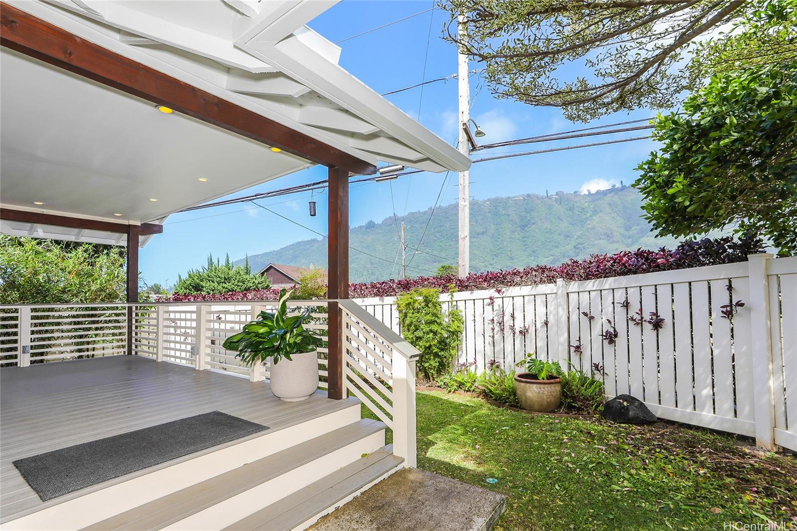 3305 East Manoa Road Honolulu, HI 96822 - Photo 21 of 25 a view of a porch with a table and chairs