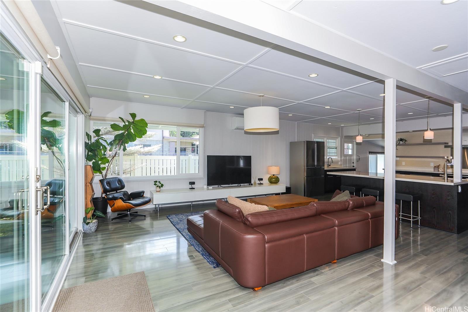 3305 East Manoa Road Honolulu, HI 96822 - Photo 5 of 25 a living room with furniture and a flat screen tv
