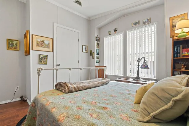 a bedroom with a bed and a tv