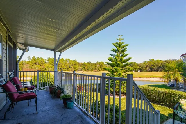 a view of a chairs and table in the balcony
